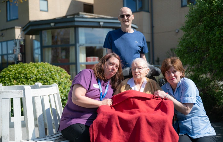 resident-and-staff-enjoy-the-sunshine-and-fresh-air-in-the-wonderful-garden.jpg