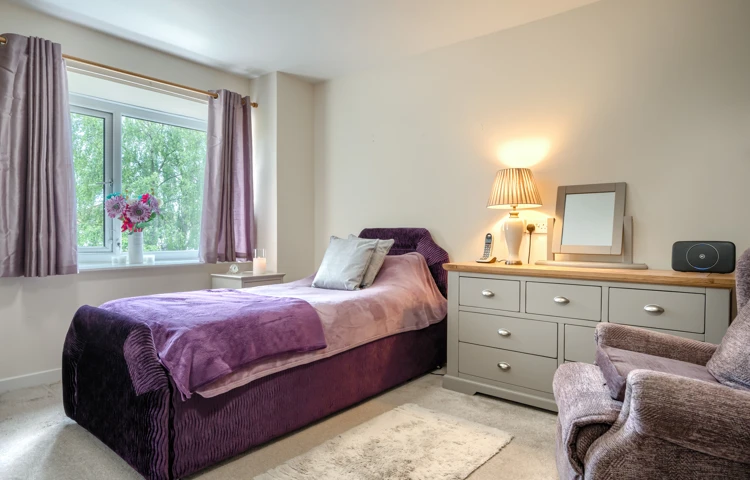 single-bedroom-with-purple-decor-at-abbeyfield-house.jpg