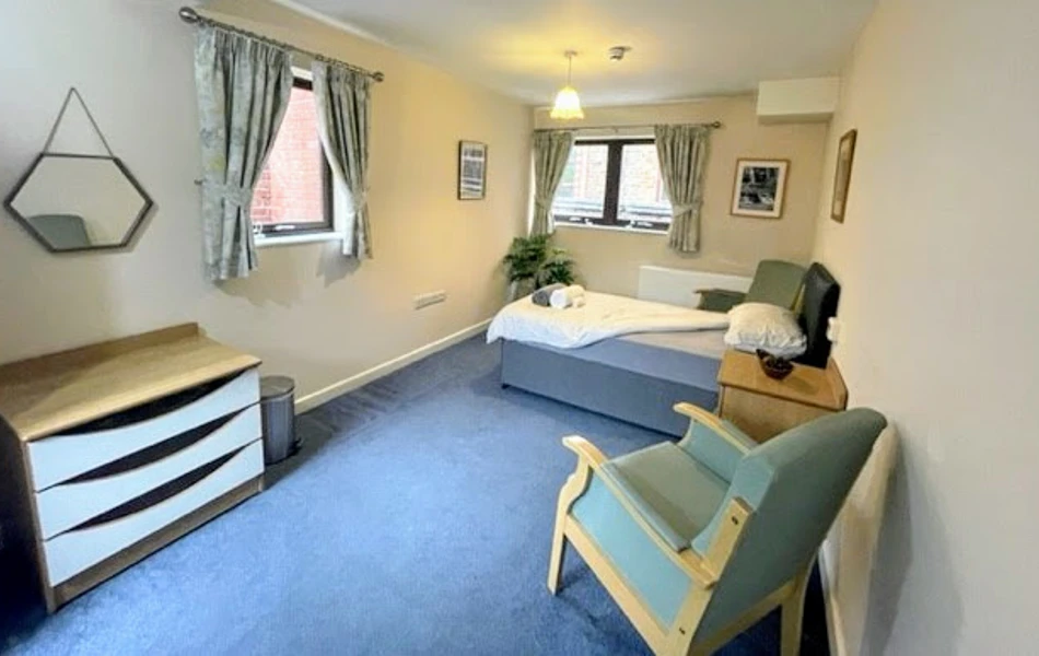A residents single bedroom at Downing House