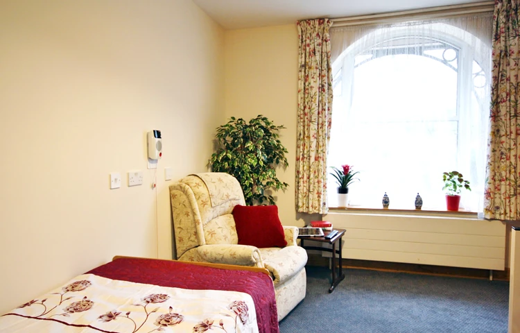 Spacious bedroom with window at Abbeyfield Maitland House