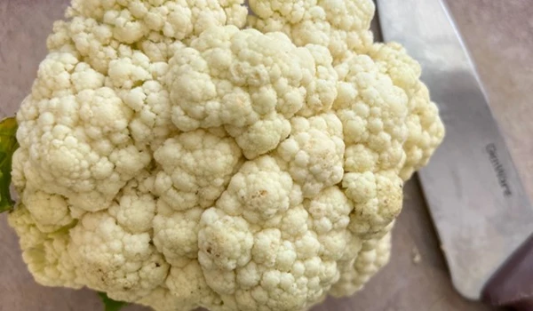 Cauliflower On A Chopping Board