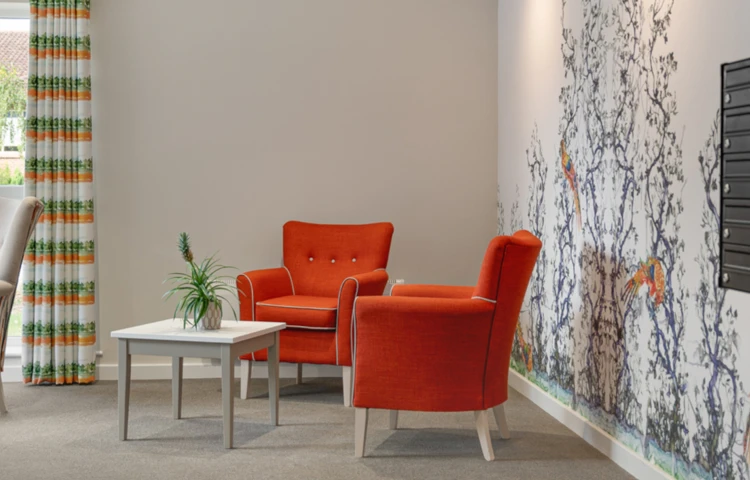 Bright Sitting Area With Orange Armchairs With A Colourful Mural, Abbeyfield House (IL), York Y024 1LL