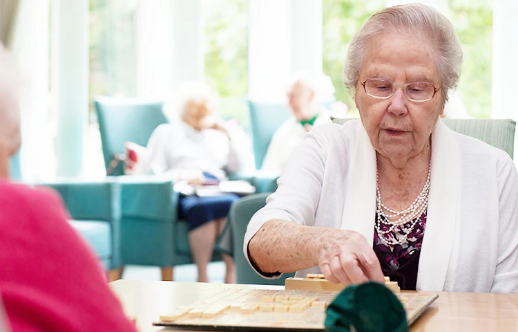 Residents in the lounge at Roundhay, Guildford GU1 2JH