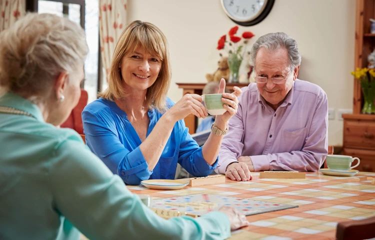 Residents playing Scrabble at Roundhay, Guildford GU1 2JH