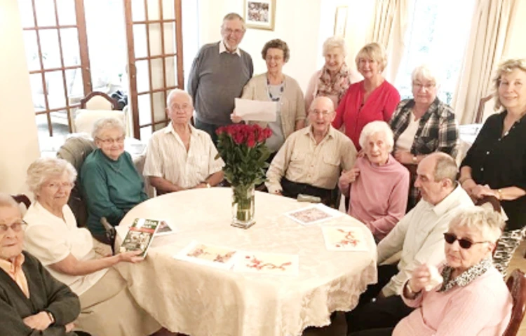Residents sat together around a table