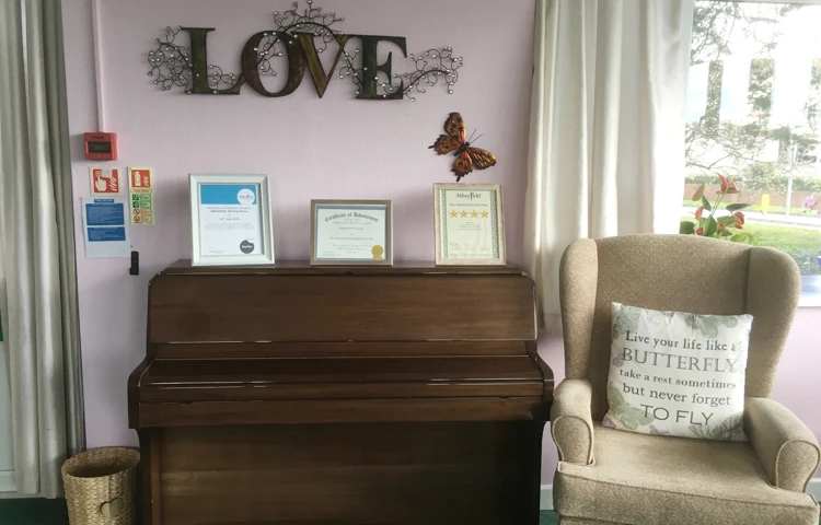 Piano and seat for residents to sit practice at Harding House