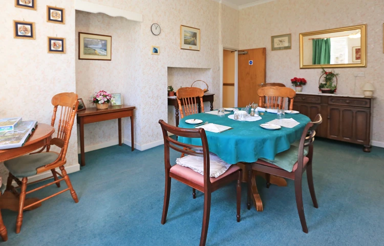 The dining area with tables set for dinner
