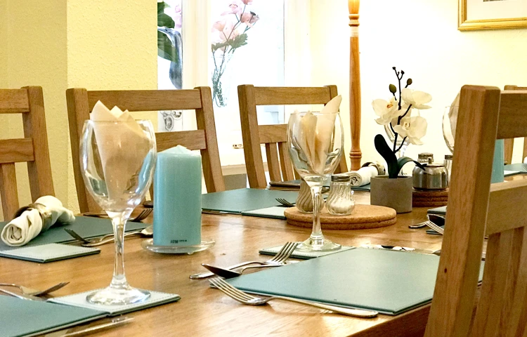 Set dining room table where residents at Abbeyfield House have meals together