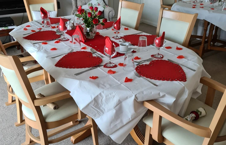 Dining room set for Valentines Day at Abbeyfield Scott House, Mawnan Smith TR11 5ER
