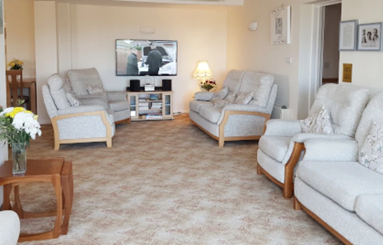 Lounge area with tv and chairs
