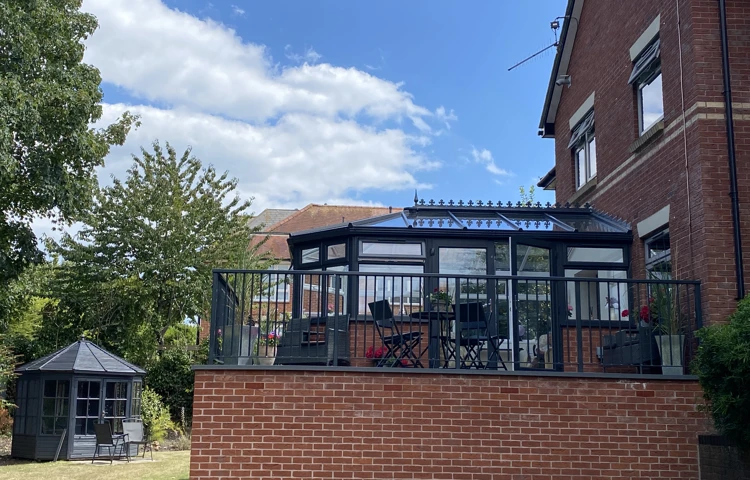 Outside view of conservatory with chairs outside at Westbourne House