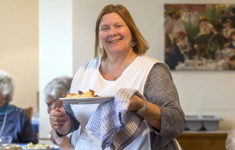Serving hot food at Abbeyfield House, Bristol BS9 3AU