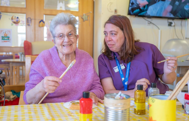 resident-and-staff-enjoy-an-arts-and-crafts-session-together.jpg