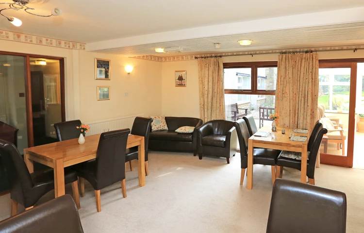 Two tables and a sofa for residents to relax
