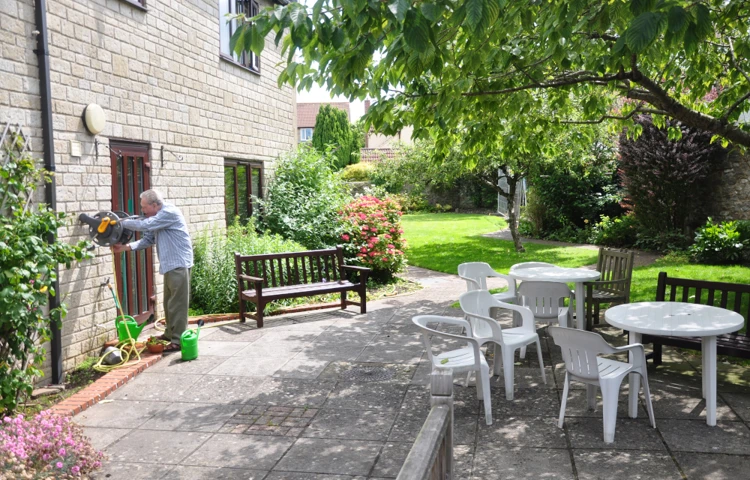 resident-in-the-sunny-garden-at-abbeyfield-house.jpg