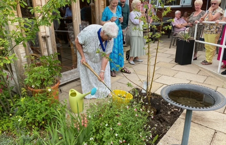 The planting of a tree at Abbeyfield House