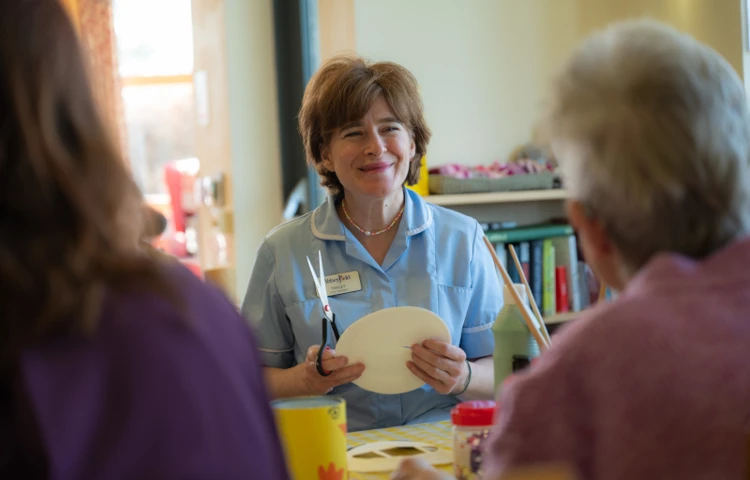 happy-staff-member-taking-part-in-an-arts-and-crafts-session.jpg