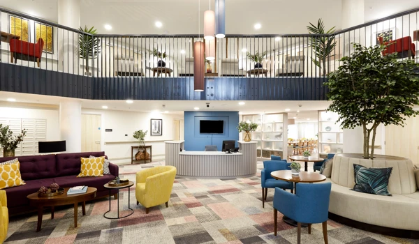 Large, modern reception area at Nonsuch Abbeyfield with sofas, seating areas and reception desk