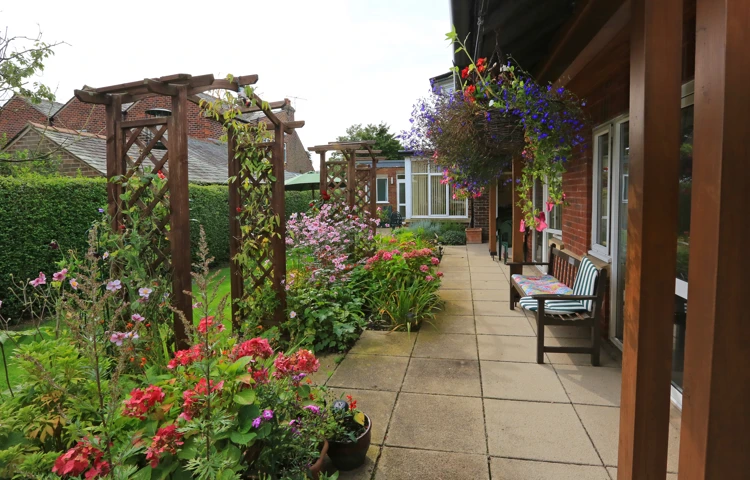 Flowers, plants and hanging baskets with seating areas